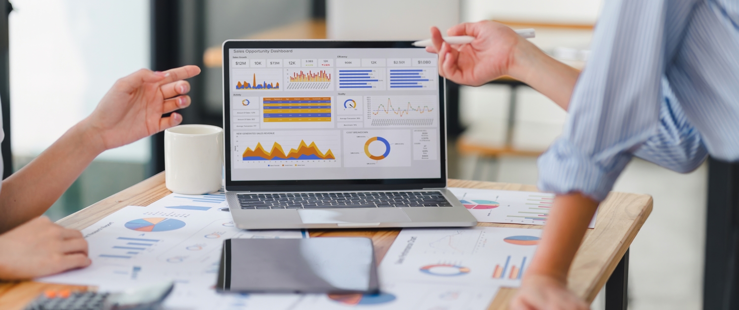 Two data analysts Working on data analysis dashboard for business strategy.
